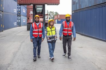 Container controllers cooperate for eco-logistics, reducing fuel consumption via smart transport.